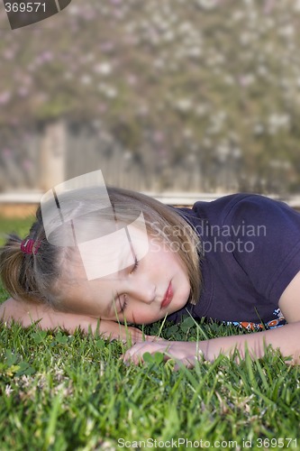 Image of girl sleeping on the grass