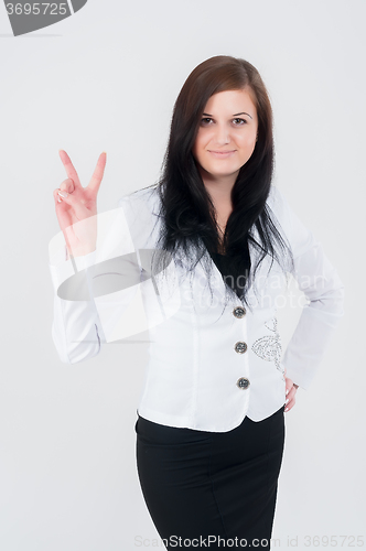 Image of Attractive woman with victory sign