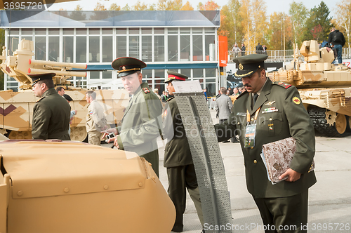 Image of Officers of foreign army studies tank T-72. Russia