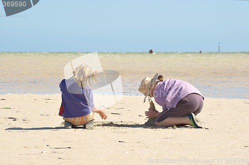Image of kids building sandcastles series no 1