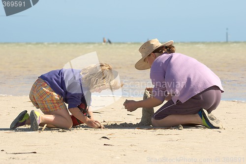 Image of kids building sandcastles series no 1
