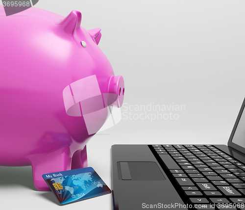 Image of Piggy At Computer Shows Saving On line