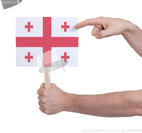 Image of Hand holding small card - Flag of Georgia