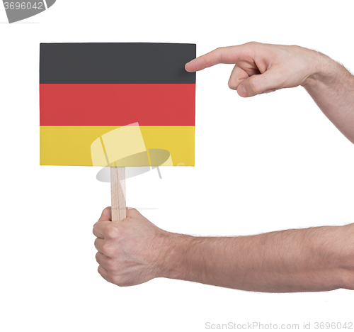 Image of Hand holding small card - Flag of Germany