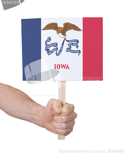 Image of Hand holding small card - Flag of Iowa