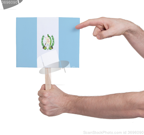 Image of Hand holding small card - Flag of Guatemala