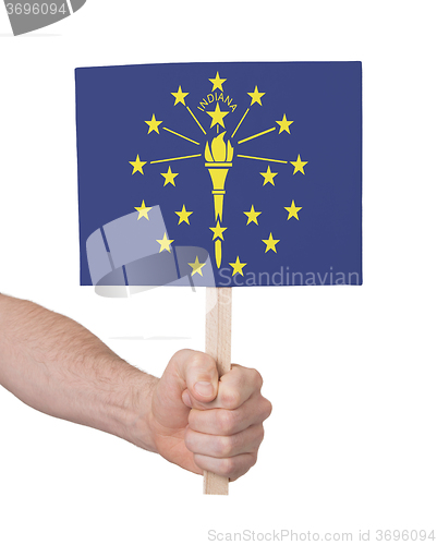 Image of Hand holding small card - Flag of Indiana