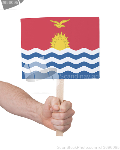 Image of Hand holding small card - Flag of Kiribati
