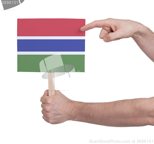 Image of Hand holding small card - Flag of Gambia