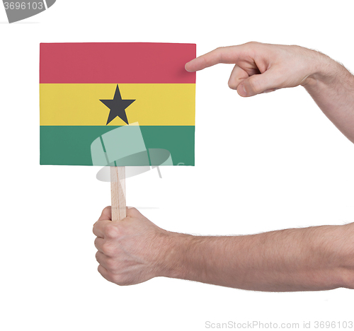 Image of Hand holding small card - Flag of Ghana