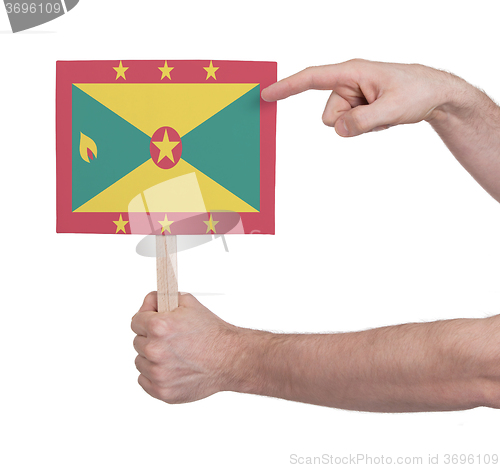 Image of Hand holding small card - Flag of Grenada