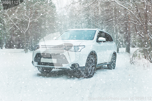 Image of Winter driving. Off-road riding on winter forest snowy road