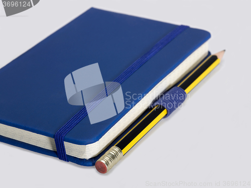 Image of blue notebook and pencil