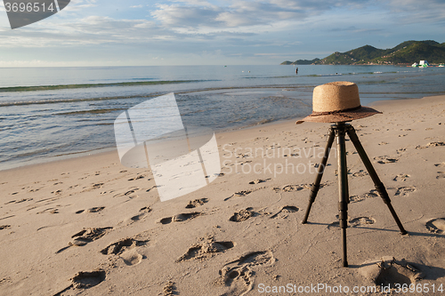 Image of Beach on tropical island. Clear blue water, sand, clouds. 