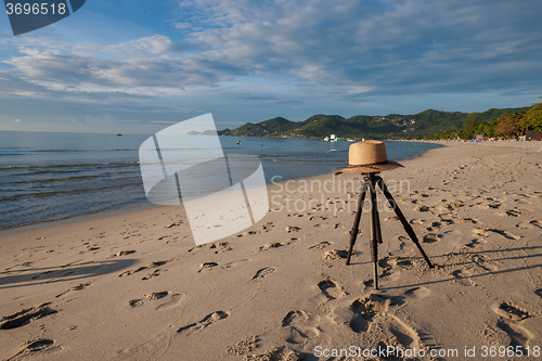 Image of Beach on tropical island. Clear blue water, sand, clouds. 