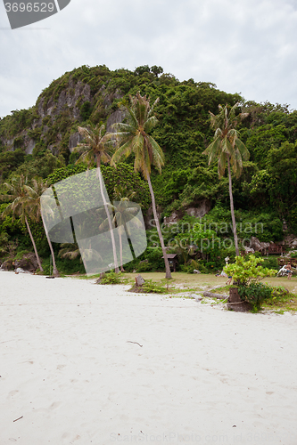 Image of Beach on tropical island. Clear sand, clouds. 