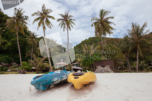 Image of Colorful kayaks on beach in Thailand