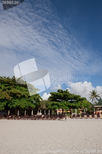 Image of Beach on tropical island. Clear sand, clouds. 