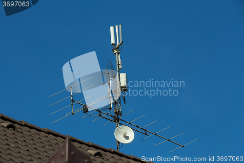 Image of television antenna and wi-fi transmitter on the roof