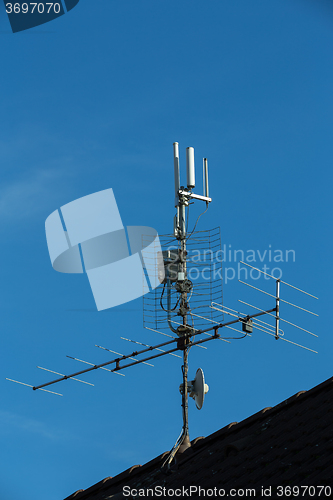 Image of television antenna and wi-fi transmitter on the roof
