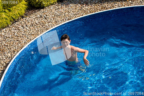 Image of Boy swimm in pool