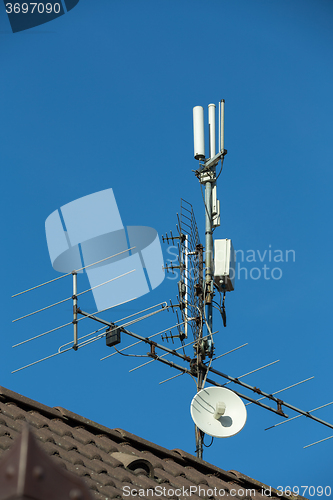 Image of television antenna and wi-fi transmitter on the roof