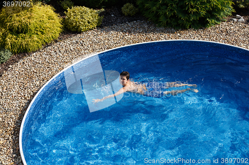 Image of Boy swimm in pool