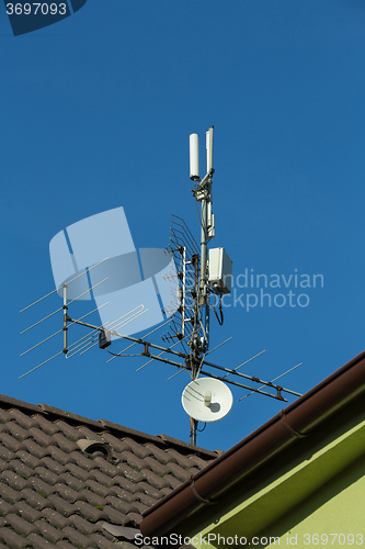 Image of television antenna and wi-fi transmitter on the roof