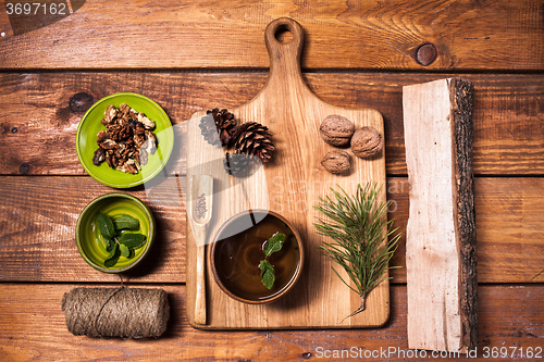 Image of Still life with walnuts on a wooden board