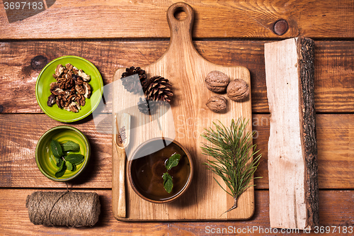 Image of Still life with walnuts on a wooden board