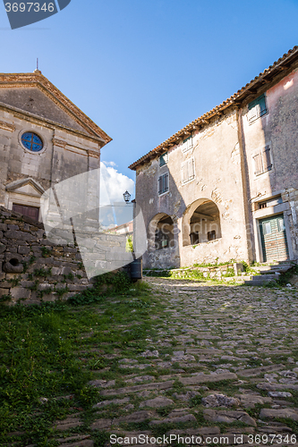 Image of cobbled pavement and stone buildings