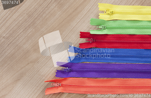 Image of Zippers wooden background