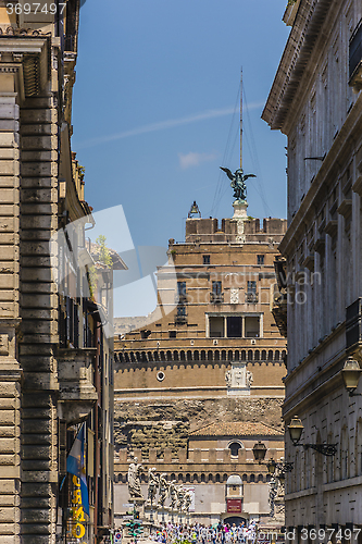 Image of Castle of the Holy Angel through buildings