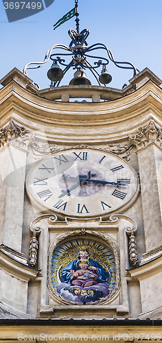 Image of Old clock and a holy mosaic