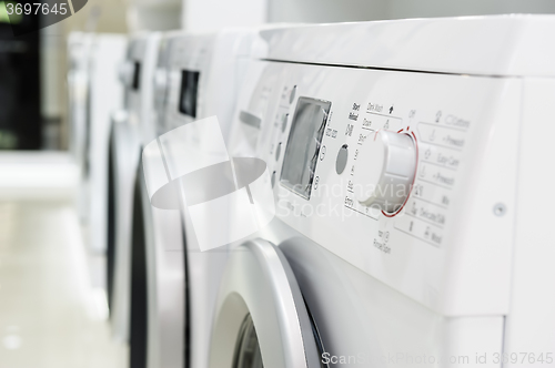 Image of washing mashines in appliance store