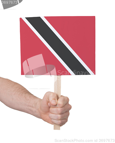 Image of Hand holding small card - Flag of Trinidad and Tobago