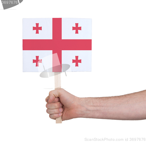 Image of Hand holding small card - Flag of Georgia