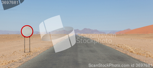 Image of Speed limit sign at a desert road