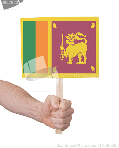 Image of Hand holding small card - Flag of Sri Lanka