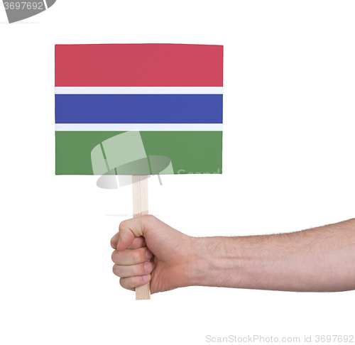 Image of Hand holding small card - Flag of Gambia