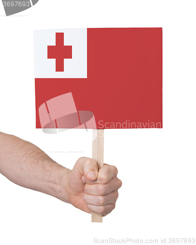 Image of Hand holding small card - Flag of Tonga