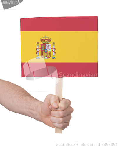 Image of Hand holding small card - Flag of Spain