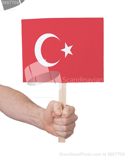 Image of Hand holding small card - Flag of Turkey