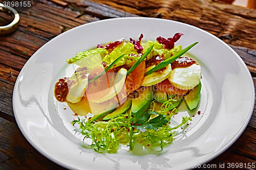 Image of Salad of celery and mandarin oranges, mozzarella cheese with herbs