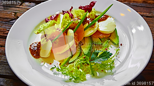 Image of Salad of celery and mandarin oranges, mozzarella cheese with herbs