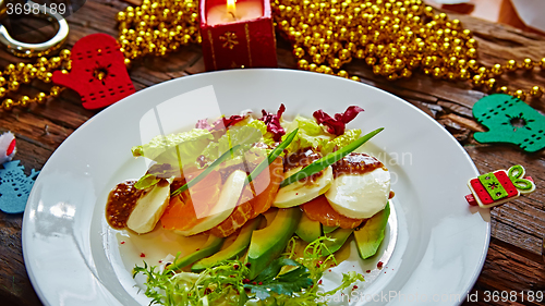 Image of Salad of celery and mandarin oranges, mozzarella cheese with herbs