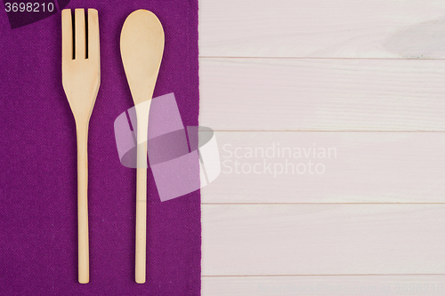 Image of Kitchenware on purple towel