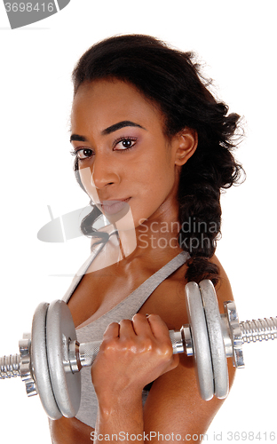 Image of Closeup of  teenager exercising with dumbbell\'s.
