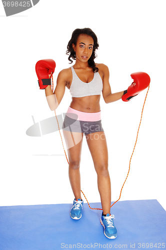 Image of Girl with boxing cloves and rope.