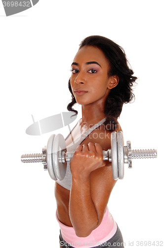 Image of Teenager girl exercising with dumbbell\'s.